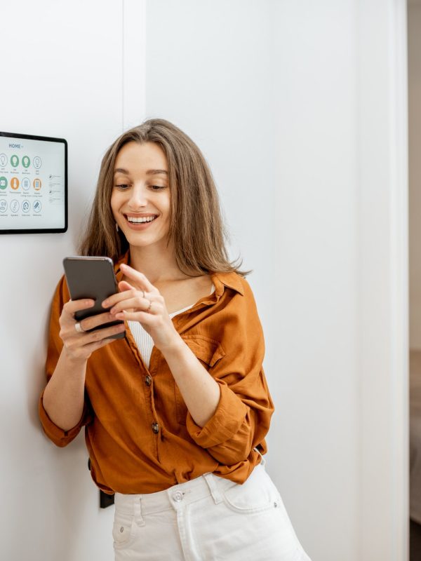 portrait-of-a-happy-woman-controlling-smart-home.jpg